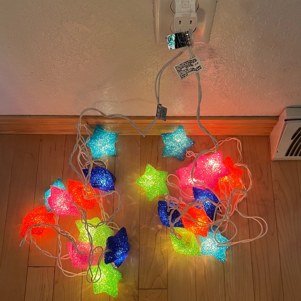 Two (2) sets of colorful, unique star string lights.